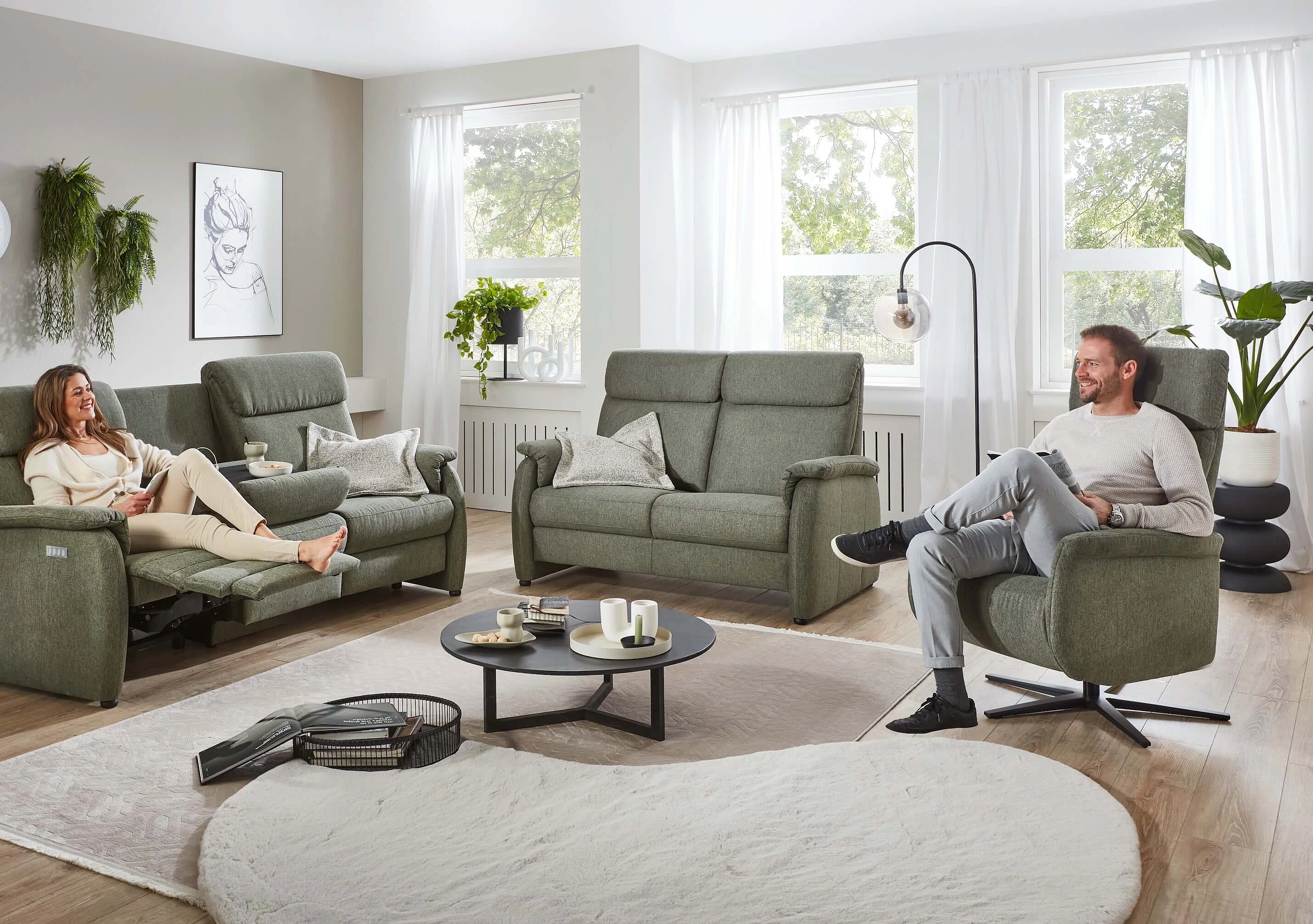 3600 single sofa and armchair upholstered in simply clean fabric in the colour turtle in a cosy atmosphere