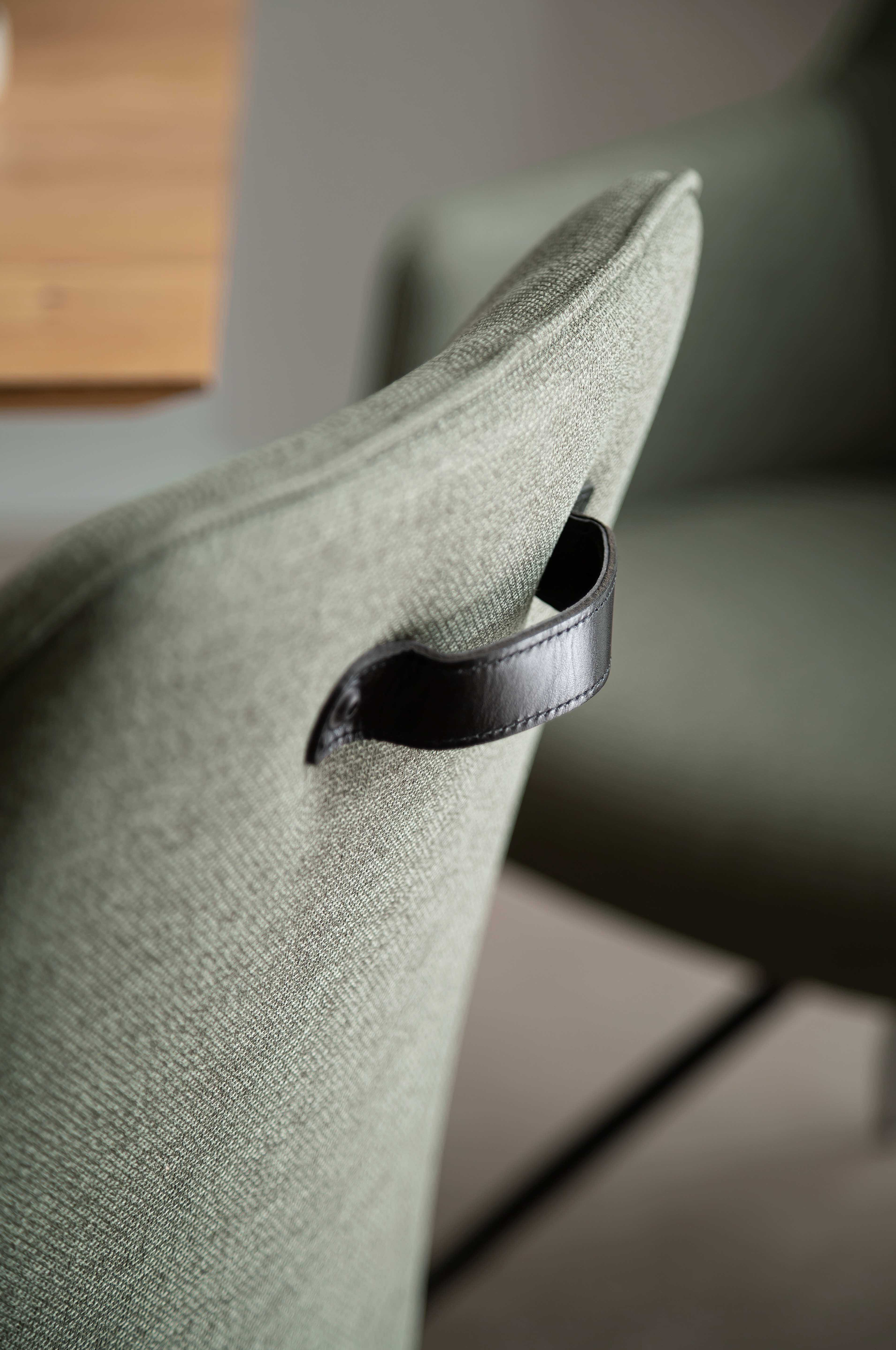 Oaklyn chair upholstered in Melrose in the colour Olive, close-up of the leather loop