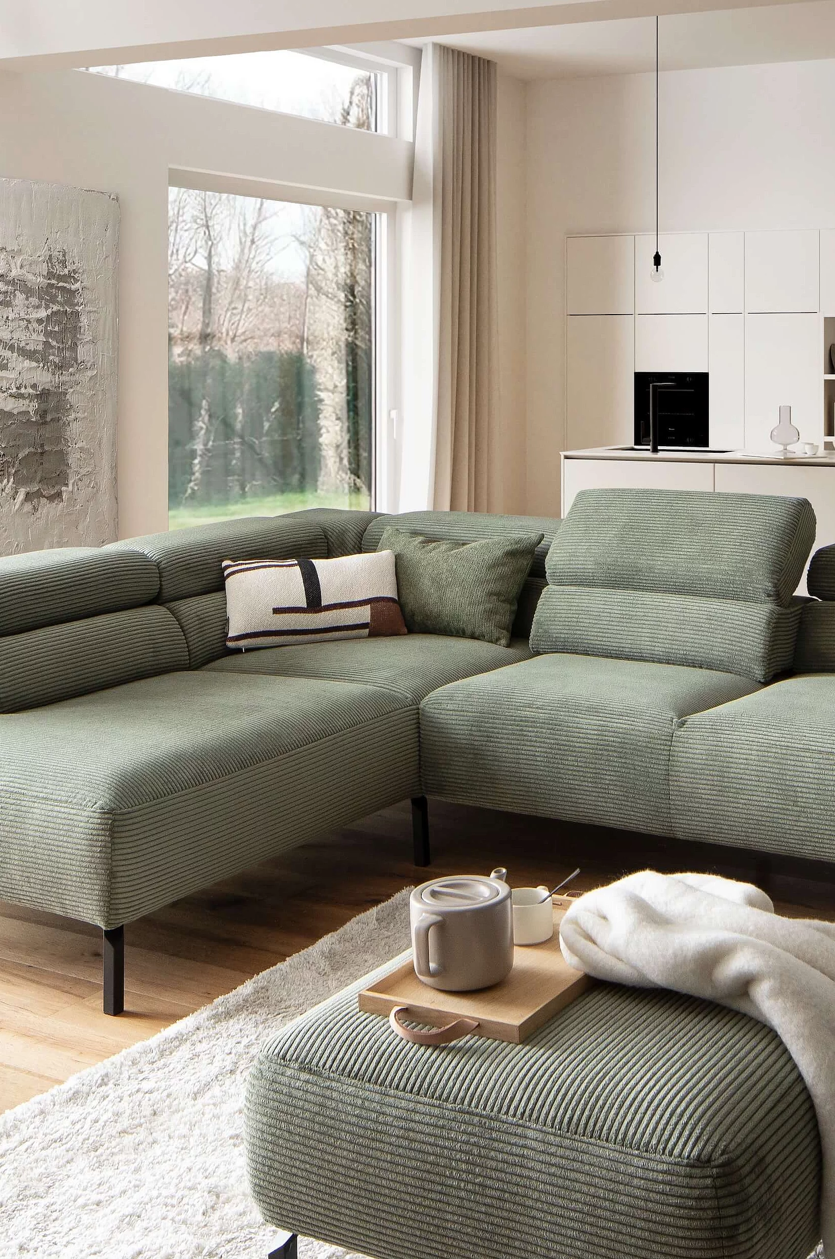 Spring Move corner sofa in corduroy upholstery in the colour turtle in a cosy atmosphere