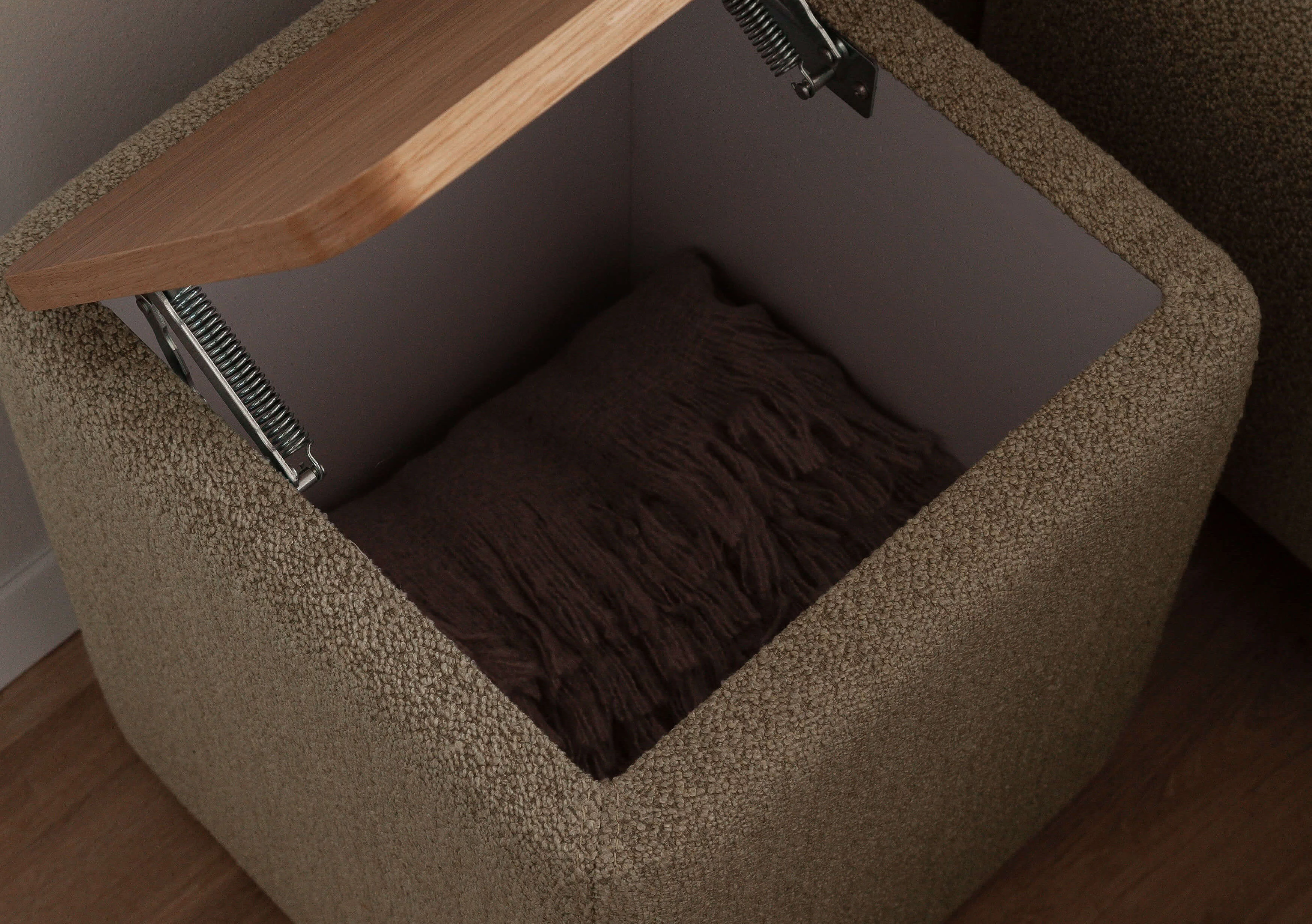 Emy bedside table with storage space and oak top in Loop cover in sand in detail
