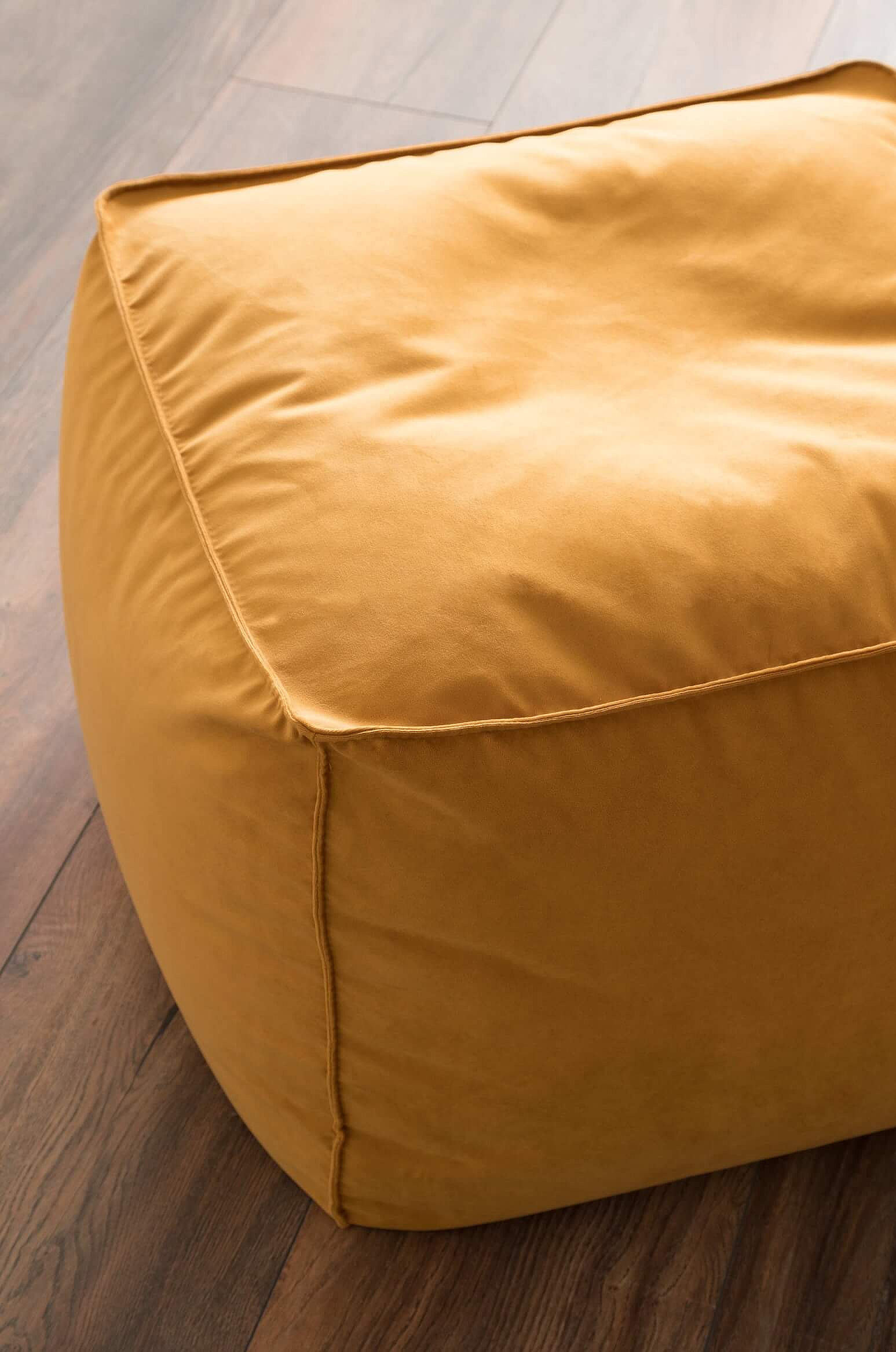 A closer look at the Noppa stool in medium size, upholstered in velvet gold