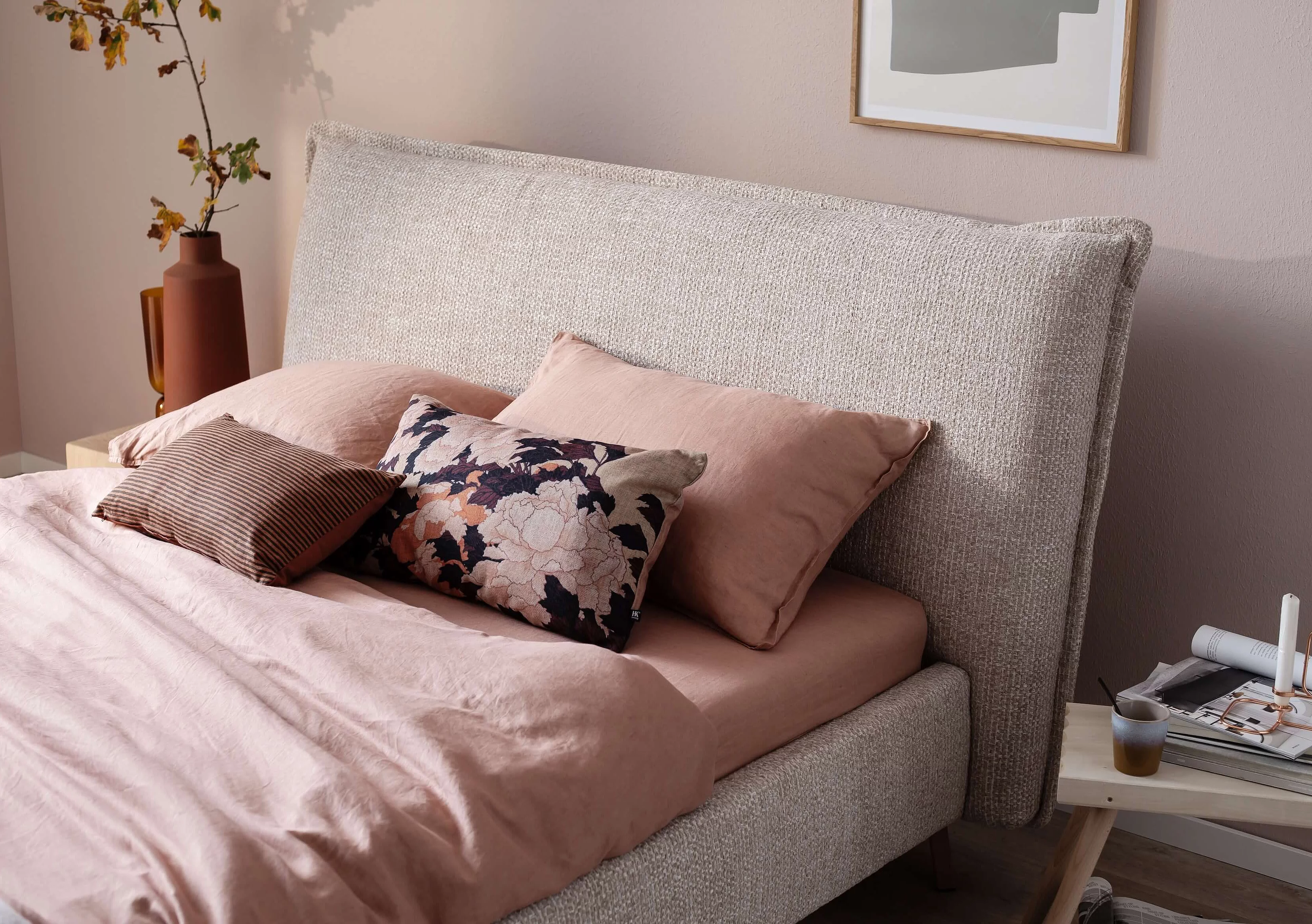 Close-up of the Ilva double bed with the Milano cover in the colour Nature 