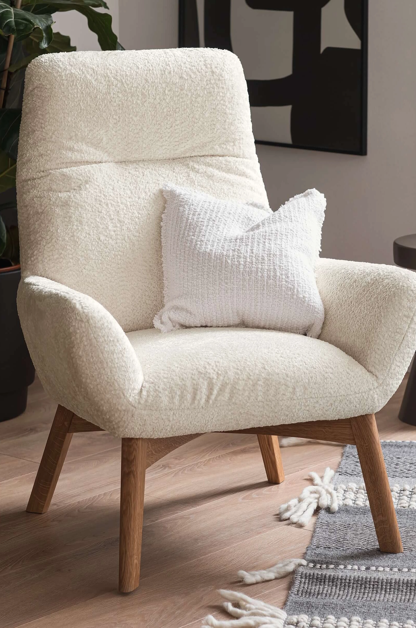 Bowie armchair upholstered in Shaun fabric in the colour White in a cosy atmosphere
