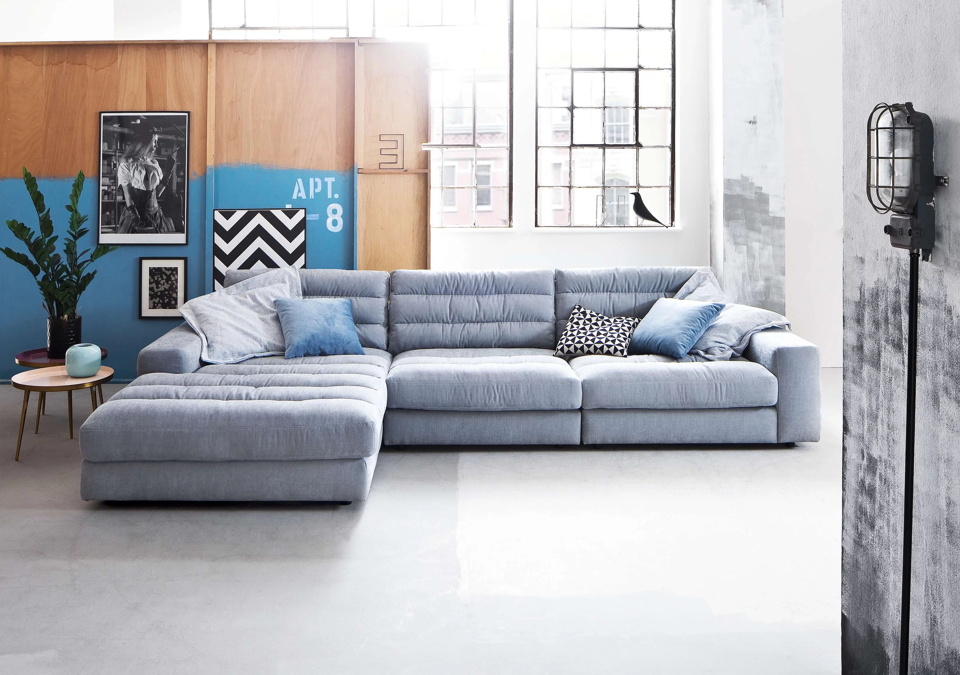 Stripes corner sofa in Yelda upholstery in light blue, as seen in a cosy atmosphere